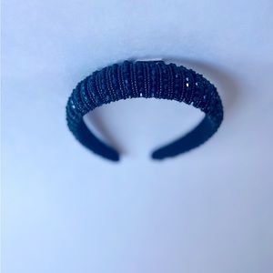 Black padded headband with jewel embellishments
